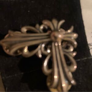 Elegant sterling silver Chrome Hearts pin and suede pouch